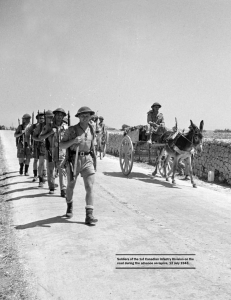 Soldiers of the 1st Canadian Infantry Division on the road during the