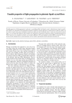 Tunable properties of light propagation in photonic liquid crystal fibers