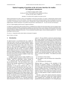 Optical trapping of particles at the air/water interface for studies in