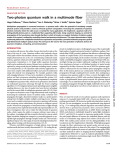 Two-photon quantum walk in a multimode fiber